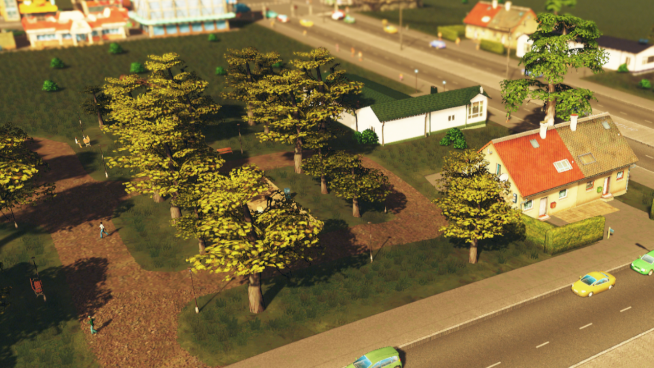 Screenshot of a park near residential homes in Cities Skylines